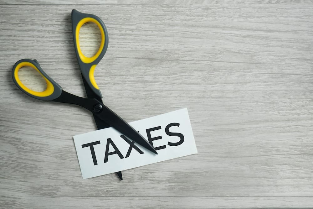 Scissors cutting taxes